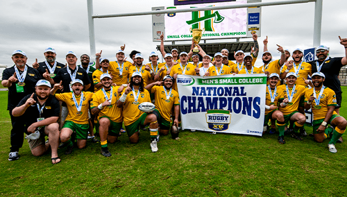 Picture of Cal Poly Humboldt Mens Rugby team and coaches holding championship banner